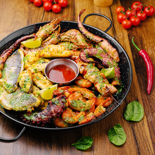 Preview: Delicious seafood platter with variety of grilled seafood and sauces served