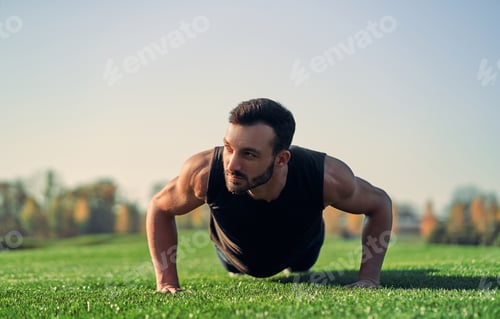 Preview: The sportsman pushing up on the grass.