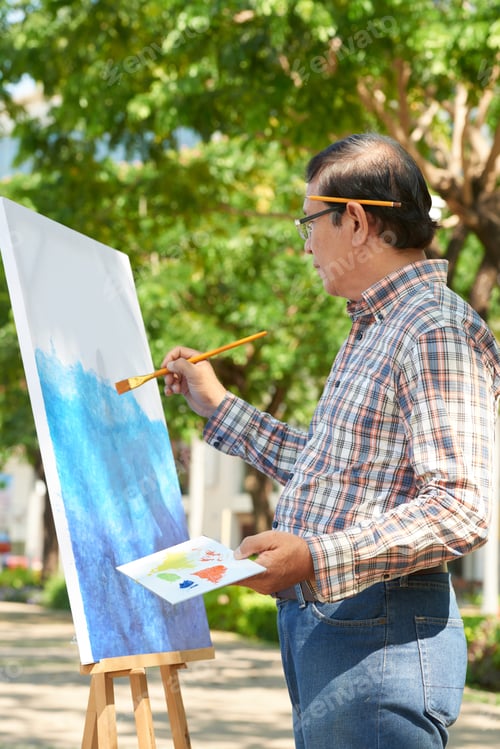 Preview: Mature Man Working On Picture