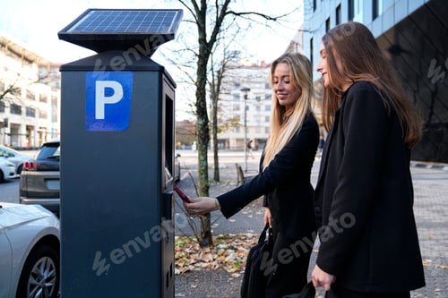 Preview: Women paying parking at solar powered machine