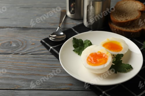Preview: Concept of breakfast with boiled eggs on wooden background