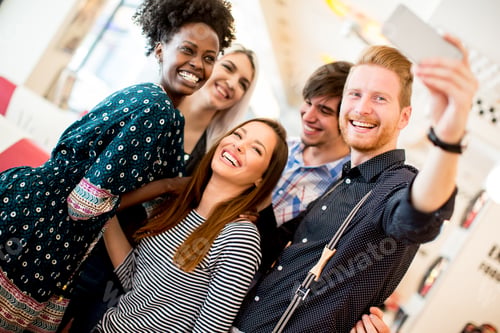 Preview: Group of young people taking selfie with mobile phone