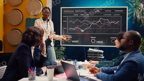 Preview: Marketing assistant presenting infographics in a status update meeting