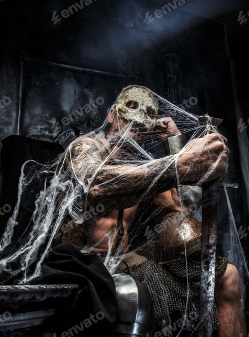 Preview: Muscular man with skull on his face.