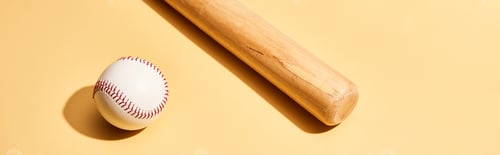 Preview: Baseball bat and ball on yellow background, panoramic shot