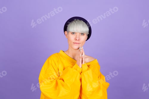 Preview: Stylish european woman on purple background happy sweet smile hands together