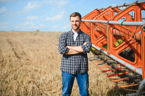 Preview: Farmer Standing In Wheat Field At Harvest