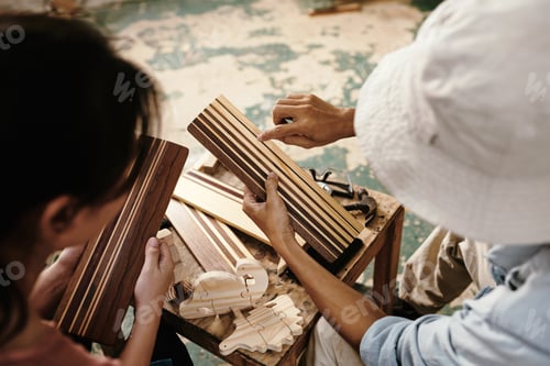 Preview: Carpenters discussing wooden planks