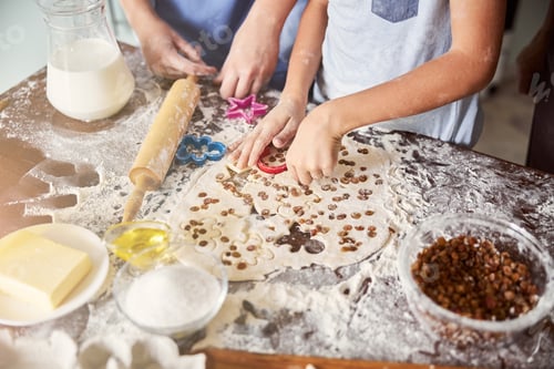 Preview: Kids covered in flour making cookie shapes out of dough