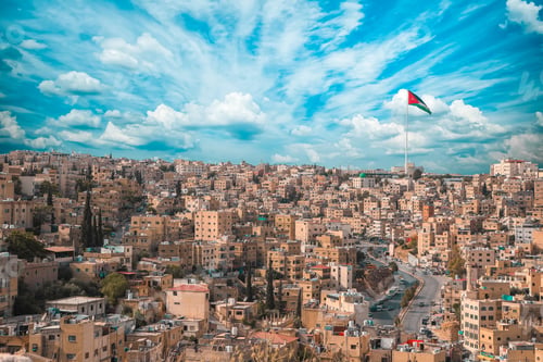 Preview: Scenic shot of the city of Amman with the Jordan flag in Jordan