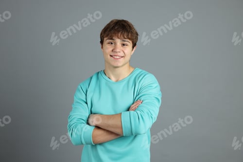 Preview: Portrait of teenage boy on grey background
