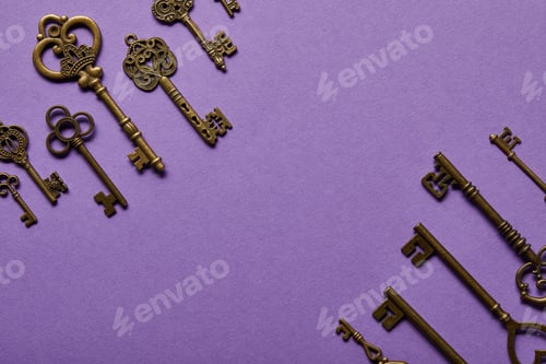 Preview: top view of vintage keys on violet background