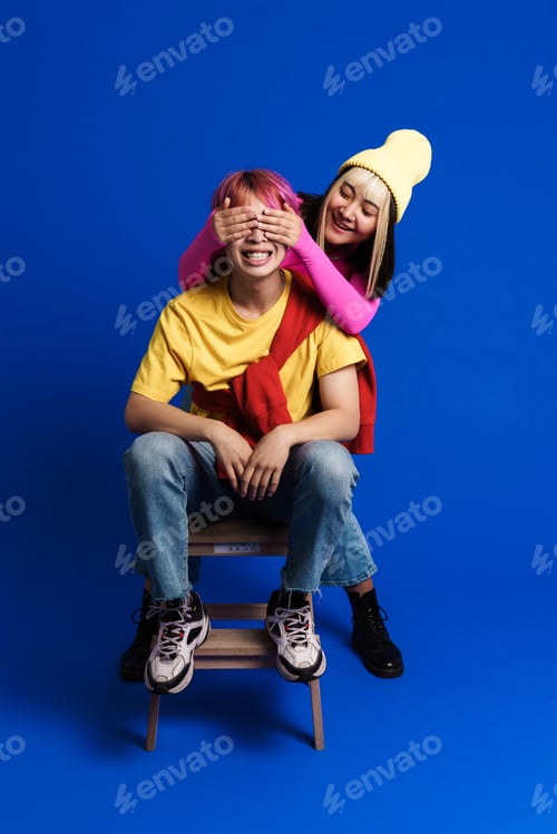 Preview: Asian girl covering his boyfriend's eyes while making fun together