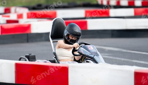 Preview: Girl In Protective Helmet Driving Karting Racing Car By Racing Track