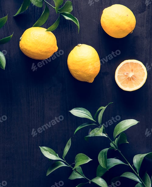 Preview: Fresh yellow lemons on black background