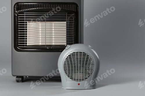 Preview: Different types of electric heaters on grey background, closeup. Space for text