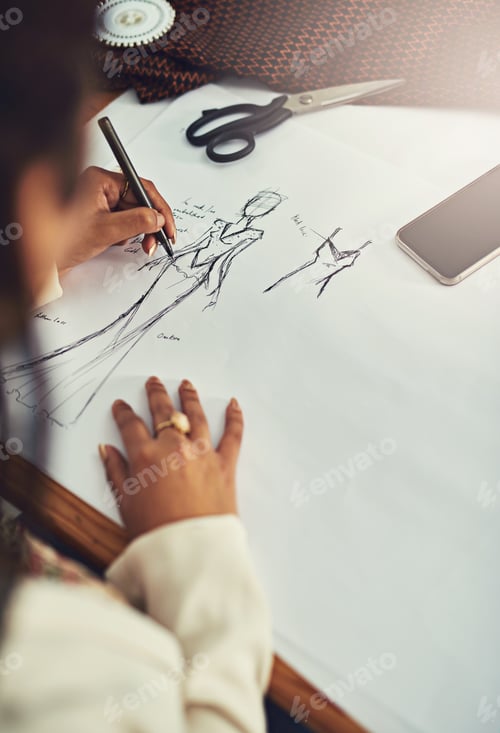 Preview: Fashion at its finest. Cropped shot of a fashion designer working on a new design.