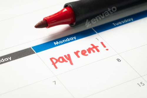 Preview: Pay rent reminder written on calendar