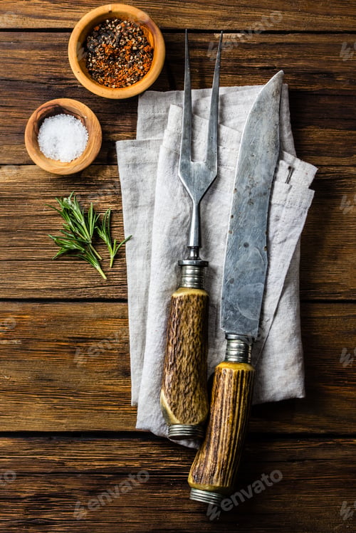 Preview: Cooking background concept. Vintage cutlery, spices on wooden background.
