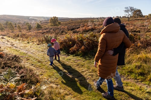 Preview: Happy family walking in the countryside
