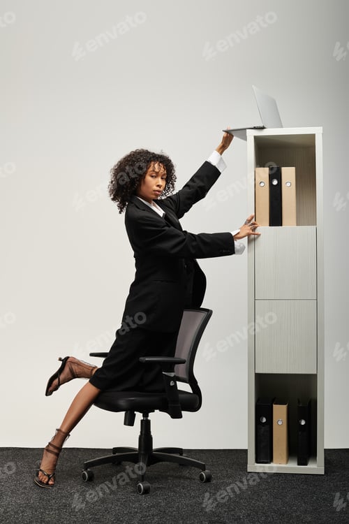 Preview: Dynamic young professional showcasing elegance and poise in modern office setting