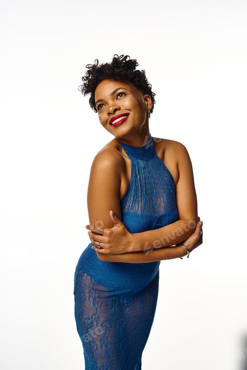 Preview: Elegant fashionista in a stunning blue dress showcasing modern chic style against a clean backdrop
