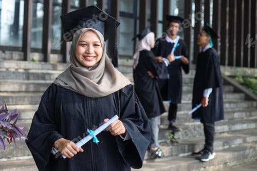 Preview: Graduate girl smiling against the background of a group of graduates