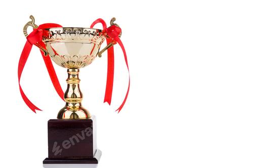 Preview: Gold trophy with red decorative ribbons on wooden table