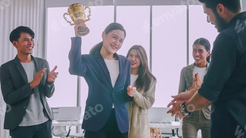 Preview: An employee of the company is proud to receive an award for a successful project.