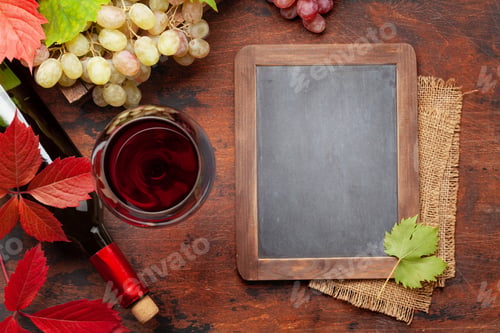 Preview: Red wine and grapes on wooden table