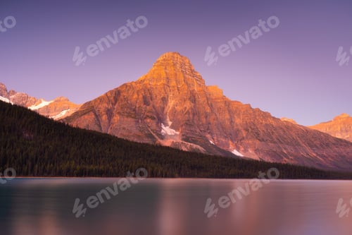 Preview: Mountain landscape at dawn. Sunbeams in a valley. Banff National Park, Alberta, Canada.