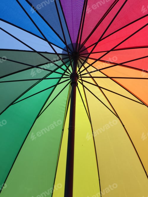 Preview: Closeup vertical shot of a colorful umbrella photographed from inside can be used as background