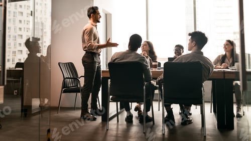 Preview: Colleagues having meeting in board room, businessman giving speech