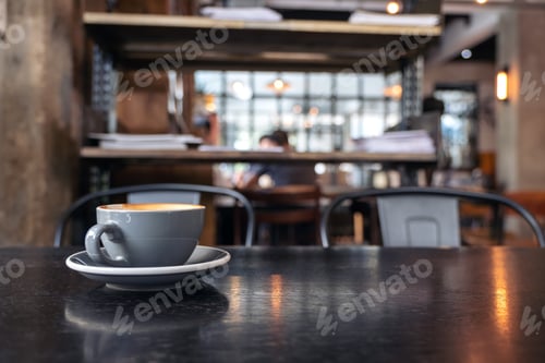 Preview: Closeup image of a blue cups of hot latte coffee on vintage wooden table in cafe
