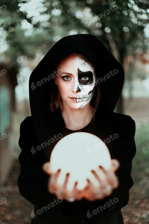 Preview: Portrait of girl during halloween holding a moon