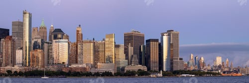 Preview: Panoramic shot of large stone buildings in downtown New York at sunset