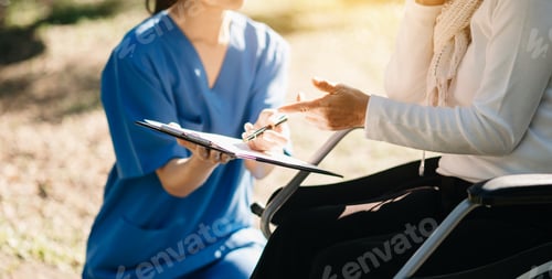 Preview: Elderly asian senior woman on wheelchair with Asian careful caregiver and encourage patient, walking