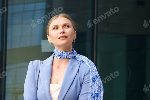 Preview: Portrait of a beautiful business woman on the background of an office building