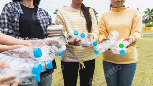 Preview: Woman Group Team Volunteer hand holding bottles garbage plastic Trash join empathy charity trust
