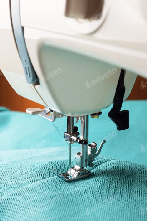 Preview: Modern sewing machine and turquoise fabric