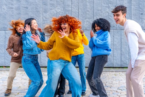 Preview: Girl dancing with a group of friends in the city