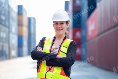 Preview: Portrait of an engineer checking products at an industrial container yard.