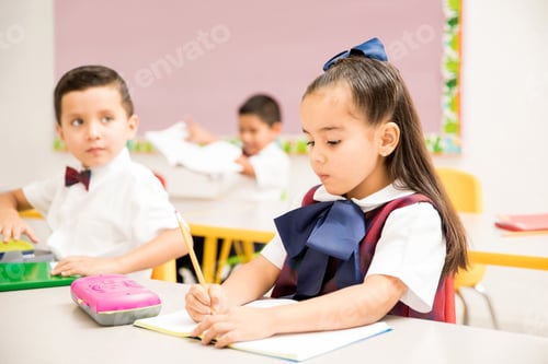 Preview: Preschool pupils writing in a classroom