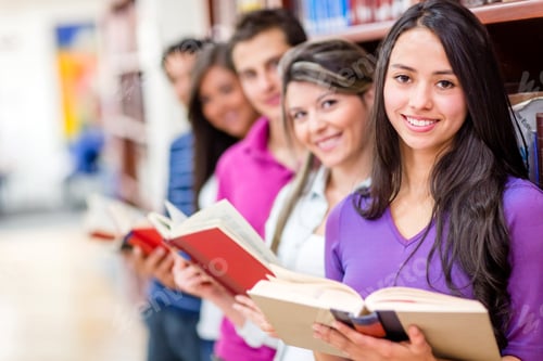 Preview: Happy Group Of Students At The Library Holding Books