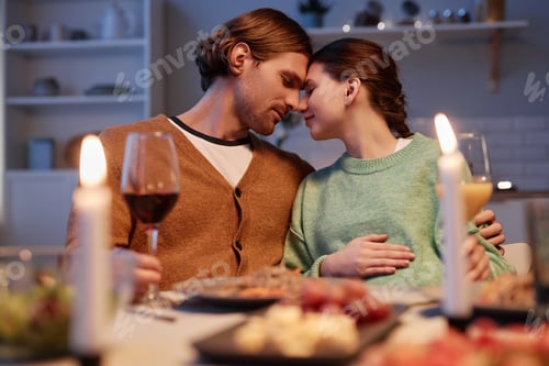 Preview: Caring young couple expecting baby and celebrating anniversary