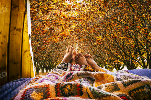 Preview: Nude feet people relaxing with autumn view