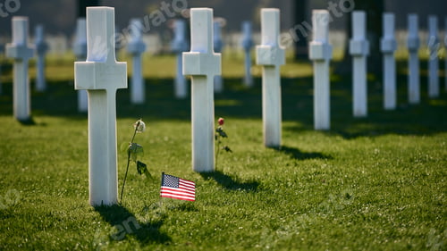 Preview: White Crosses and American Flag in Cemetery