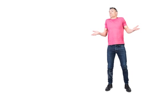 Preview: Uncomprehending man spreading hands and shrugging shoulders