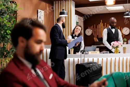 Preview: Hotel concierge assisting client