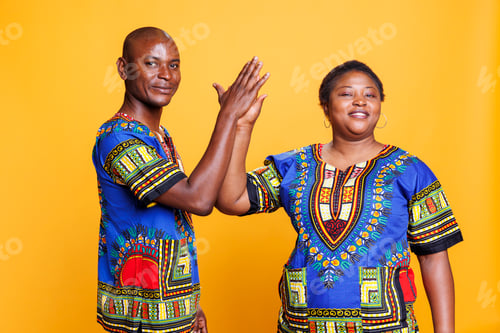 Preview: Black man and woman giving high five